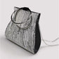 Glänzende schwarze Party-Clutch mit Perlen und silbernen Kreisgriffen – Silber und Gold