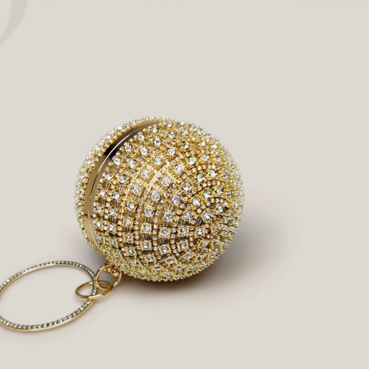 Ausgefallene, schillernde Goldkugel-Clutch im Diamant-Look