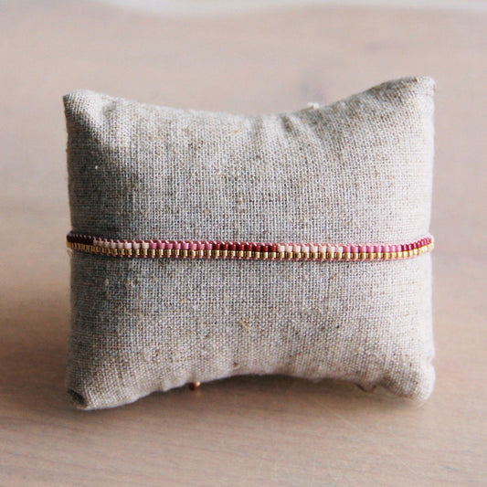 Geflochtenes Armband in Rosa-/Goldtönen