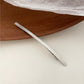 Einreihige, minimalistische Haarspange aus Metall in Gold und Silber