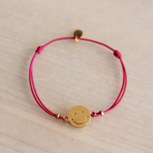 Elastisches Armband mit Smiley – leuchtendes Rosa/Gold