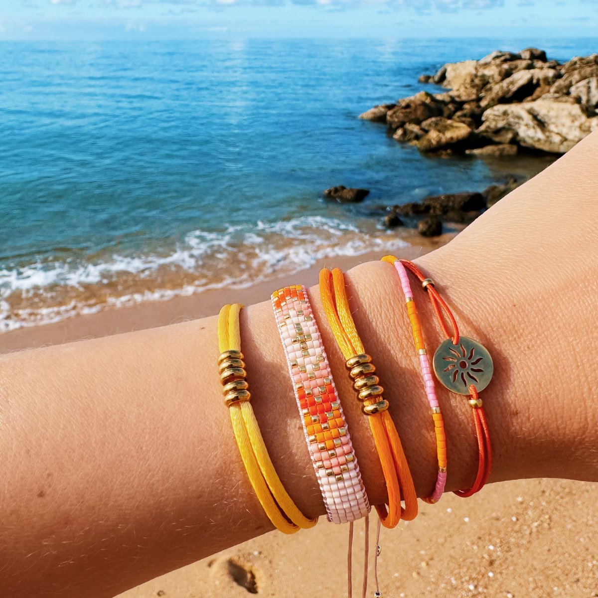 Elastisches Armband mit Sonne – Orange/Gold